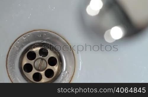 Tap faucet dripping water