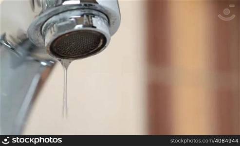 Tap faucet dripping water