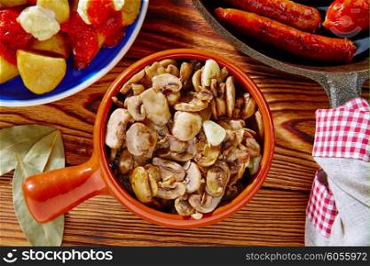 Tapas from Spain champinones mushrooms with potatoes and sausage