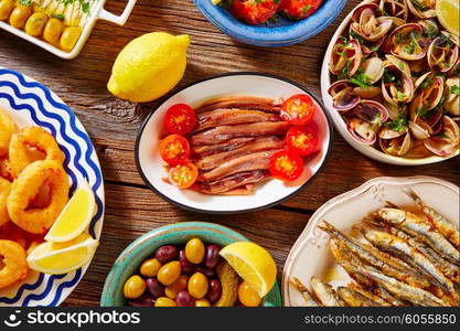 Tapas spanish seafood clams shrimps and fried anchovies fish