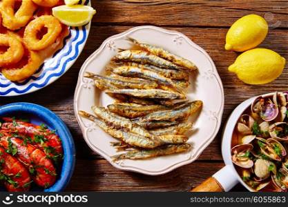Tapas spanish seafood clams shrimps calamari romana and fried anchovies fish