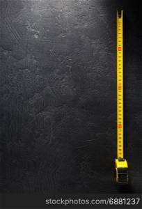 tape measure on black background texture