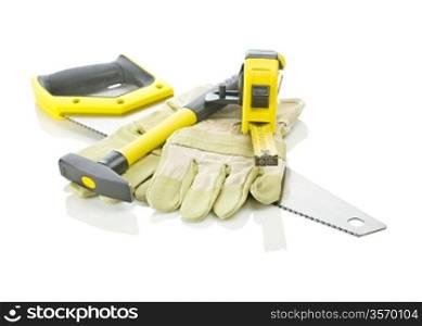 tapeline, hammer and gloves on saw