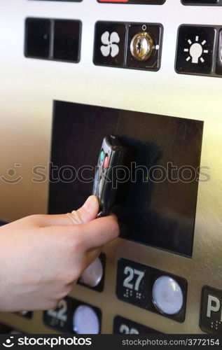 Tapping key tag on elevator