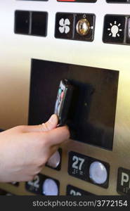 Tapping key tag on elevator