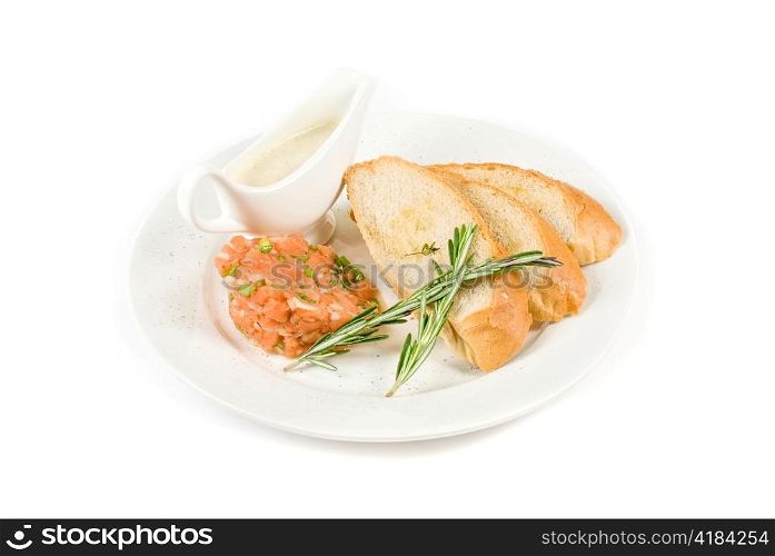 Tar-tar from salmon fish with green onion. Served with honey sauce and white bread toast.