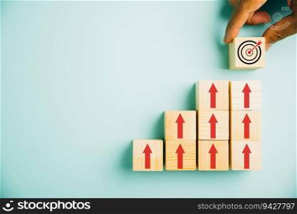 Target icon placed on wooden blocks, accompanied by upward arrows. Bar graph chart steps symbolize business growth on blue background, emphasizing profit, investment, and economic improvement concepts