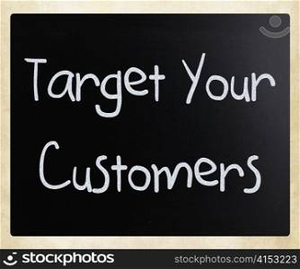 ""Target your customers" handwritten with white chalk on a blackboard"