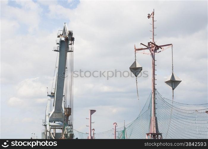 Targets for warship, with crane in background.
