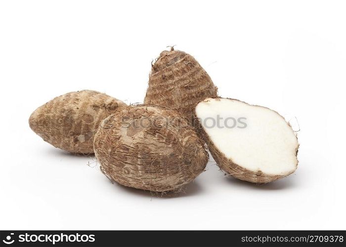 Taro roots on white background