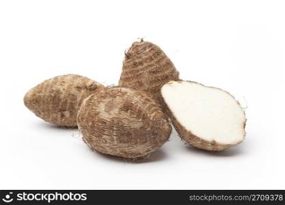 Taro roots on white background