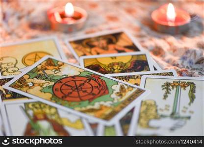 Tarot card with candlelight on the darkness background for Astrology Occult Magic illustration / Magic Spiritual Horoscopes and Palm reading fortune teller concept