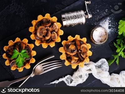 tartalets. tartalets with fried mushrooms, fried mushrooms in tartalets