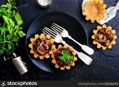 tartalets. tartalets with fried mushrooms, fried mushrooms in tartalets