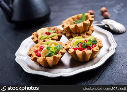 tartalets with berries. tartalets with fresh fruit and berries, desert with berries