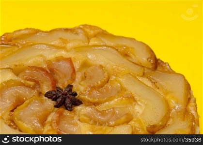 Tarte Tatin apple and pear tart pie isolated on yellow background with copy space