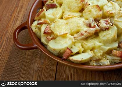 Tartiflette - French dish from the Savoie and Haute Savoie region. made with potatoes, reblochon cheese, lardons and onions.