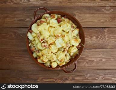 Tartiflette - French dish from the Savoie and Haute Savoie region. made with potatoes, reblochon cheese, lardons and onions.