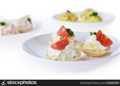 tartlet with cream and dill on dish