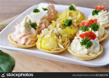 tartlet with cream and dill on dish