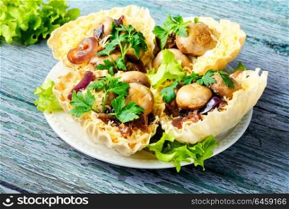 Tartlet with mushrooms. Tartlet - a small basket of fresh dough with mushroom snacks