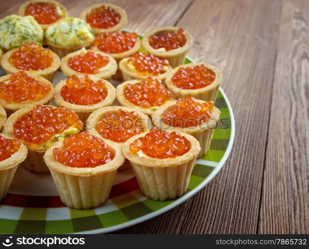 Tartlet with red caviar . Shallow depth-of-field