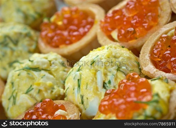 Tartlet with red caviar . Shallow depth-of-field
