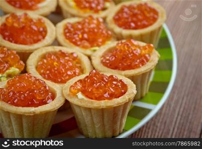 Tartlet with red caviar . Shallow depth-of-field