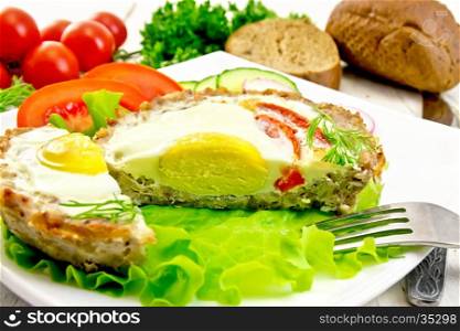 Tartlets meat with egg and tomato cut in the plate on lettuce, bread and dill on the background light wooden boards