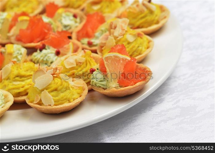 tartlets with cheese sauce and salted salmon