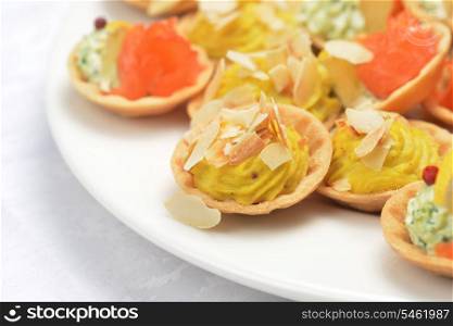 tartlets with cheese sauce and salted salmon
