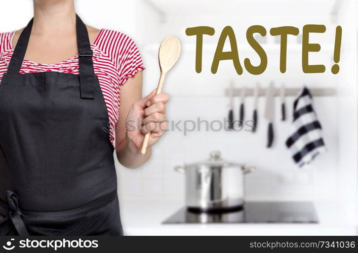 taste cook holding wooden spoon background concept.. taste cook holding wooden spoon background concept