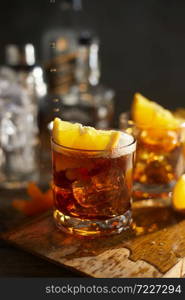 Tasty alcoholic old fashioned cocktail with orange slice