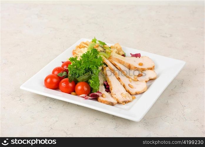 Tasty appetizer of meat, cherry tomato, greens and groundnut