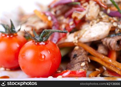 Tasty appetizer of roast beef meat, marinated chicken meat, cherry tomato and other vegetables