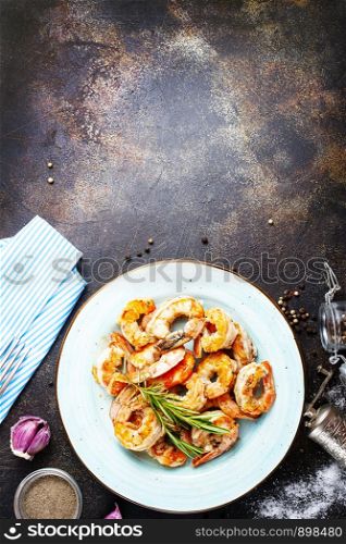 Tasty appetizing fried grilled shrimps with spices