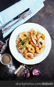 Tasty appetizing fried grilled shrimps with spices