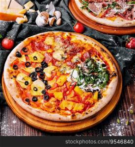 Tasty assorted pizzas on a wooden background