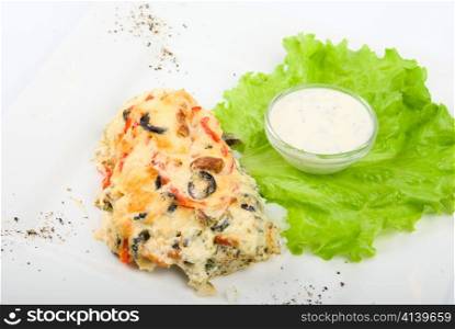 Tasty baked fish dish on a white
