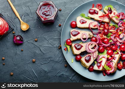 Tasty baked meat with berry, cherry sauce for meat.. Pork with cherry sauce.