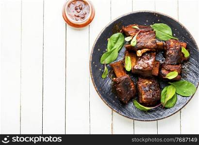 Tasty BBQ beef ribs seasoned with spicy sauce. Roasted beef brisket on the ribs,copy space
