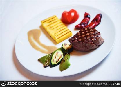 tasty bbq meat food, juicy beef steak with grilled cheese and salad in restaurant
