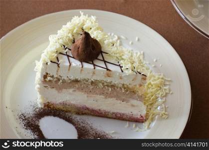 tasty cake at white plate closeup photo