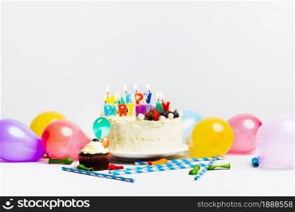 tasty cake with berries happy birthday title near colourful balloons. Resolution and high quality beautiful photo. tasty cake with berries happy birthday title near colourful balloons. High quality and resolution beautiful photo concept