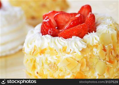 tasty cakes with nuts and strawberries closeup