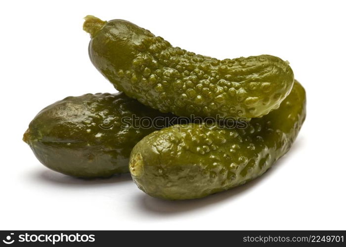Tasty canned Whole green cornichons isolated on a white background. High quality photo. Tasty canned Whole green cornichons isolated on a white background