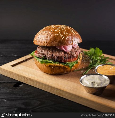 tasty cheeseburger wooden board ready be served. Resolution and high quality beautiful photo. tasty cheeseburger wooden board ready be served. High quality and resolution beautiful photo concept