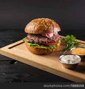 tasty cheeseburger wooden board ready be served. Resolution and high quality beautiful photo. tasty cheeseburger wooden board ready be served. High quality and resolution beautiful photo concept