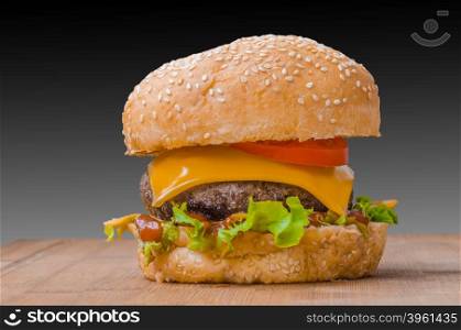 Tasty cheeseburgers with lettuce; beef; double cheese and ketchup. Shallow focus.
