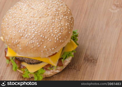 Tasty cheeseburgers with lettuce; beef; double cheese and ketchup. Shallow focus.